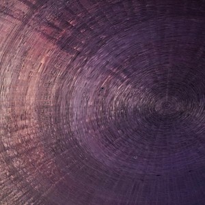 Intricate abstract spiral pattern with a gradient effect creating depth and texture.